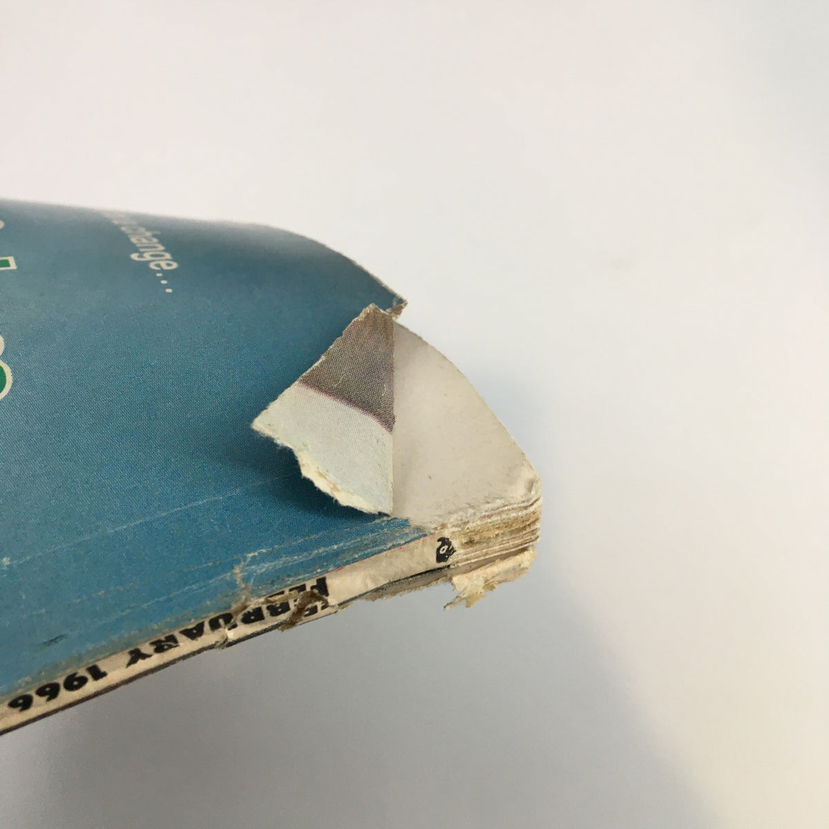 Damaged corner of the cover of VTG True Story Magazine February 1966, highlighting imperfections like a tear, reflective of its age and collectible condition.