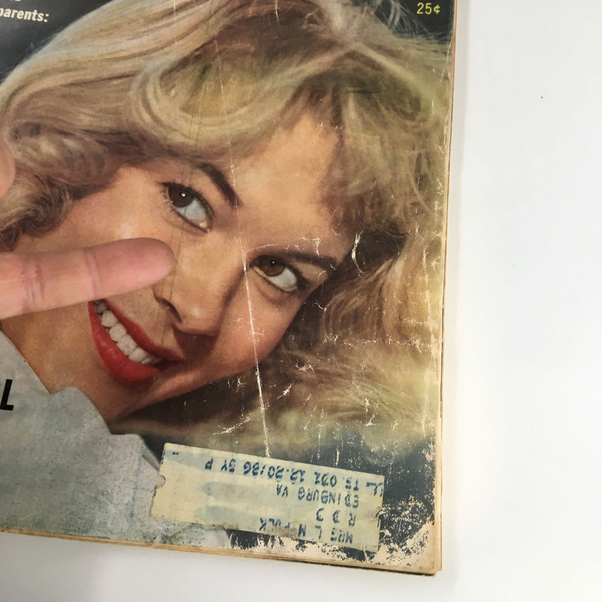 Close-up of the cover of VTG True Story Magazine showcasing a smiling blonde woman with a partially visible address label.