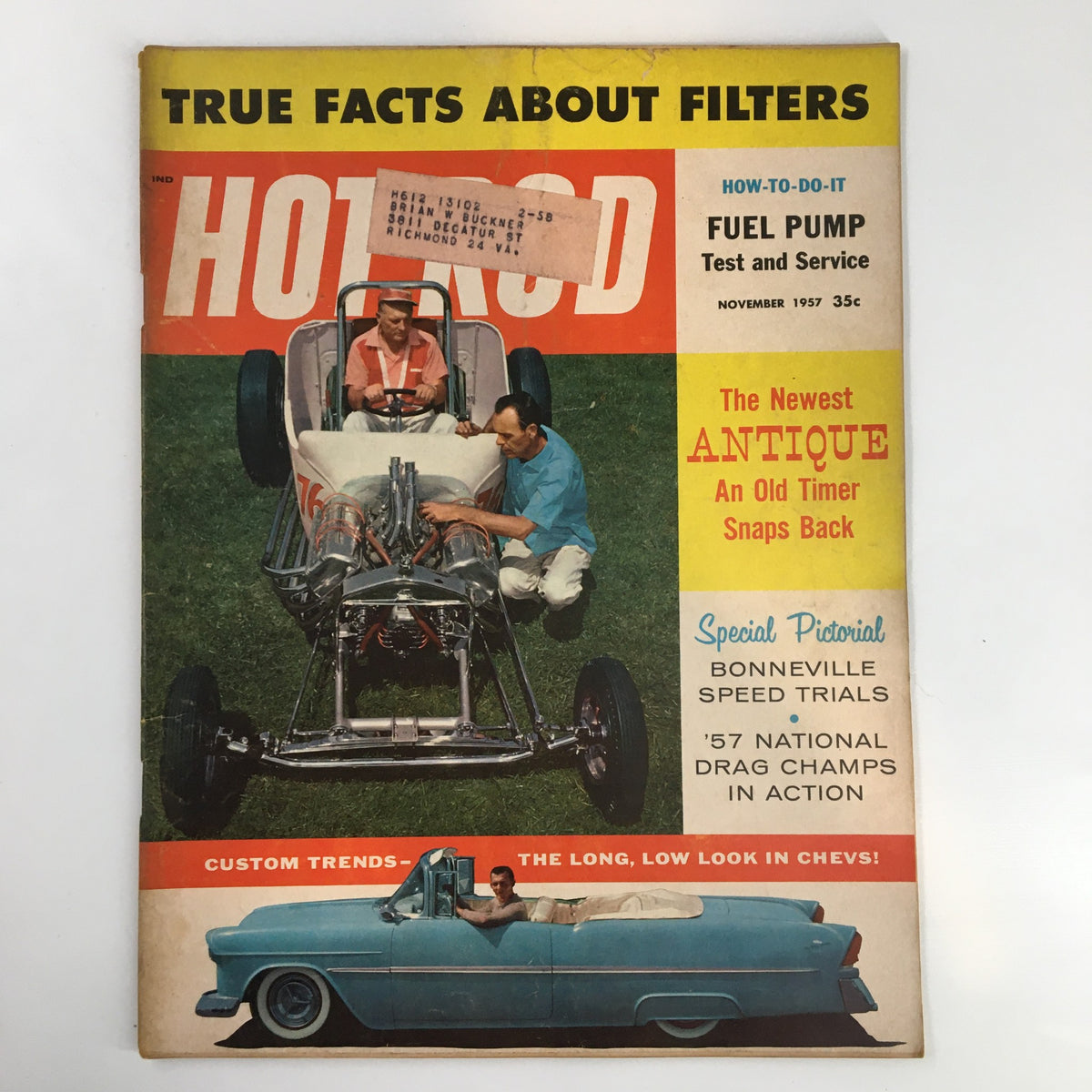 Cover of Hot Rod Magazine from November 1957 featuring the title 'The Newest Antique: An Old Timer Snaps Back', showcasing two individuals working on a vintage race car.