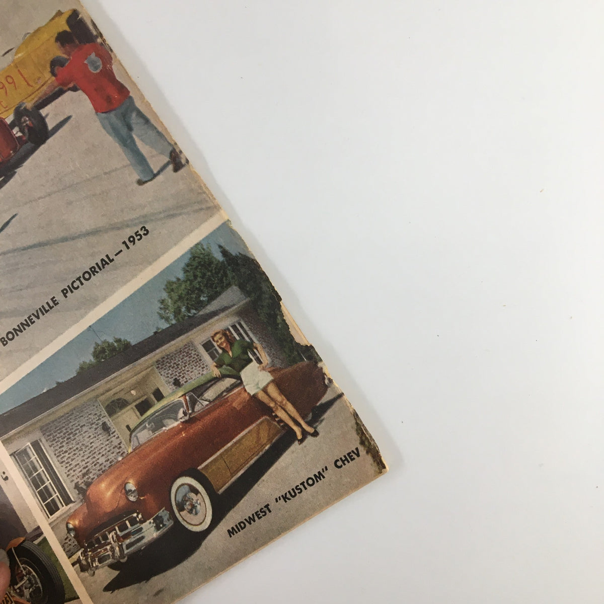 Side view of the VTG Hot Rod Magazine from December 1953 cover, highlighting a Midwest 'Kustom' Chevy and other classic cars, illustrating the post-war car scene.