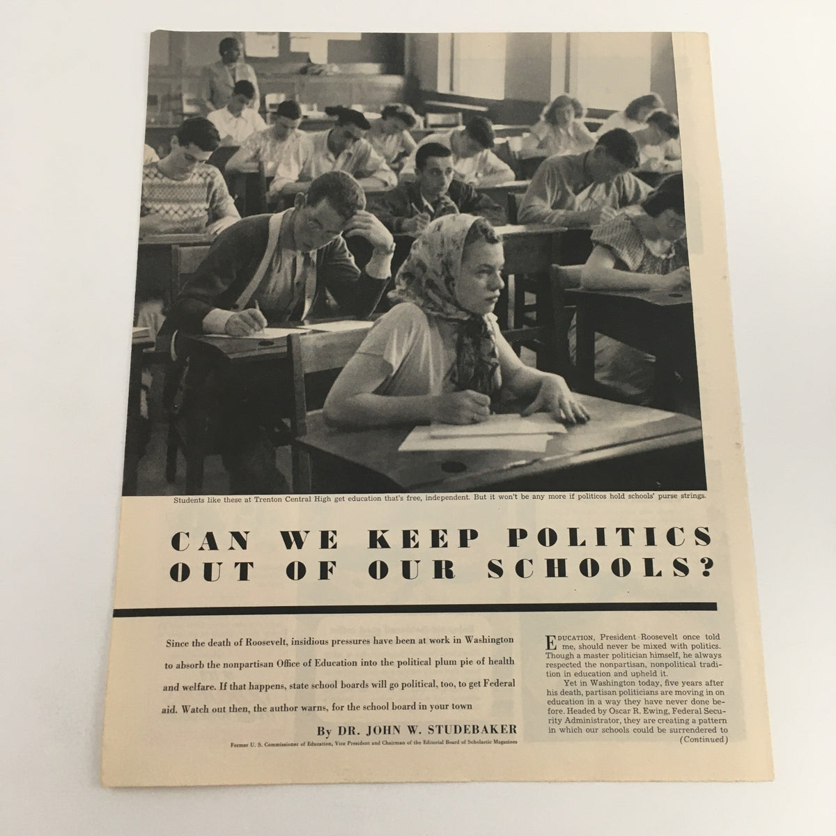 1950 vintage print ad titled 'Can We Keep Politics Out of Our Schools?' showcasing a classroom scene with students at desks deep in concentration.