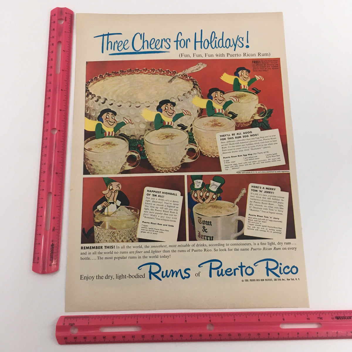 Vintage print ad titled 'Three Cheers for Holidays!' featuring Puerto Rican rum and festive drinks with playful illustrations, ideal for collectors of nostalgic beverage advertisements.