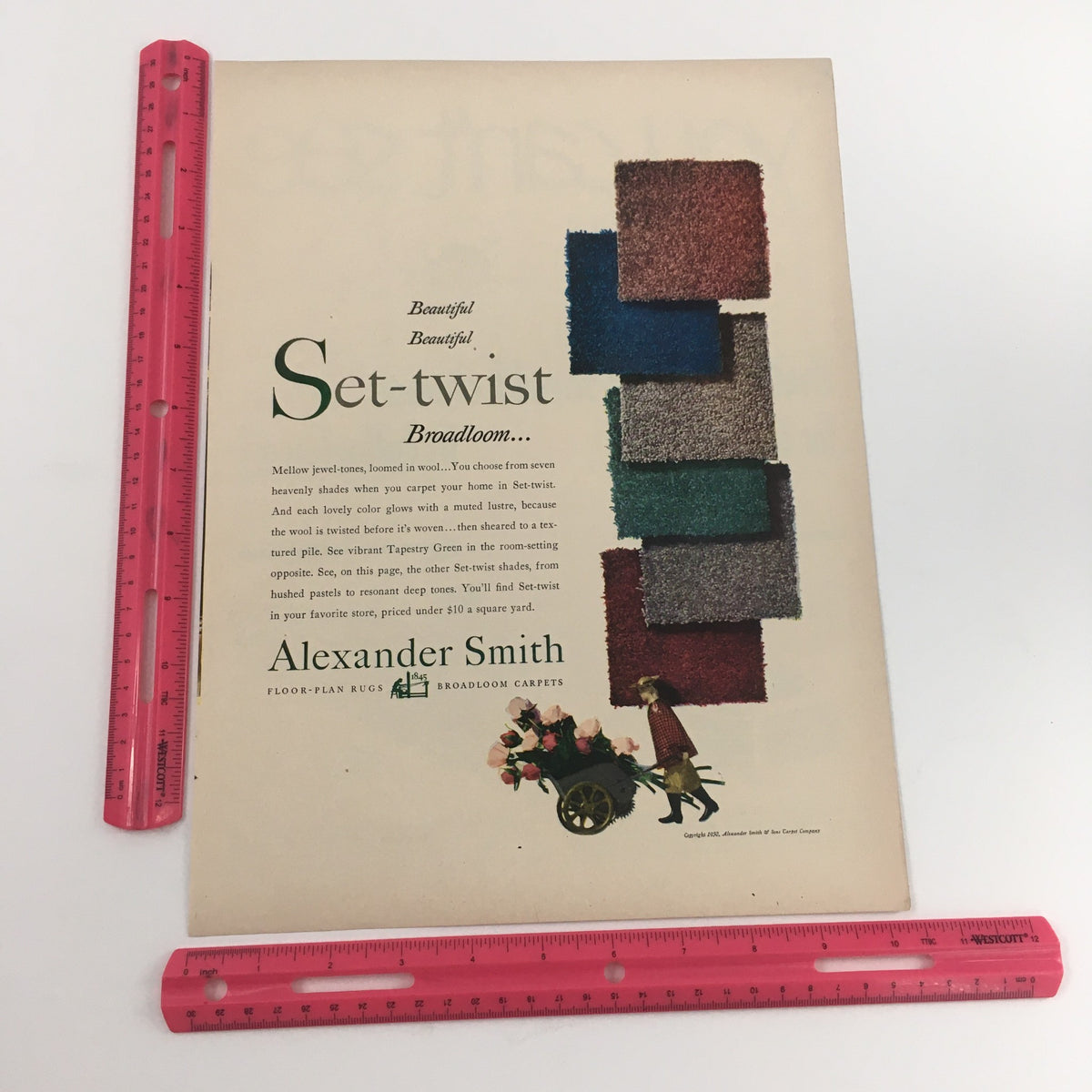 1950 Alexander Smith Floor Plan Rugs Broadloom Carpets Vintage Print Ad showcasing a vibrant set-twist broadloom carpet with a character pushing a cart.