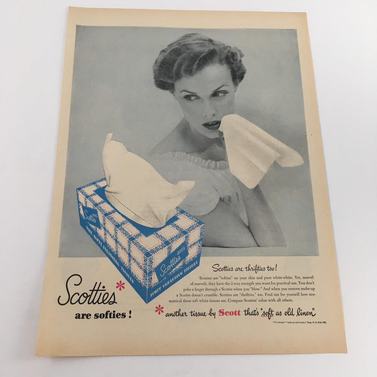 1950 U.S. Army and U.S. Air Force Recruiting Station Vintage Print Ad showcasing a vintage Scotties tissue advertisement with a woman holding a tissue, representing marketing strategies of the era.