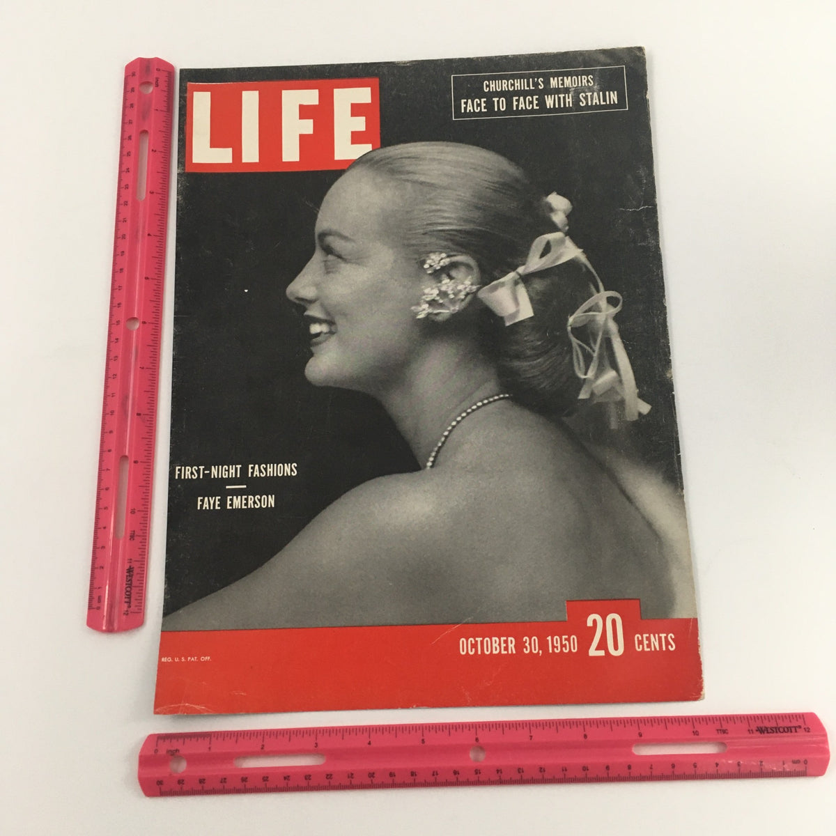 Life Magazine cover from October 30, 1950, with a profile image of Faye Emerson, displaying fashion jewelry, accompanied by rulers for size reference and the magazine's price of 20 cents.