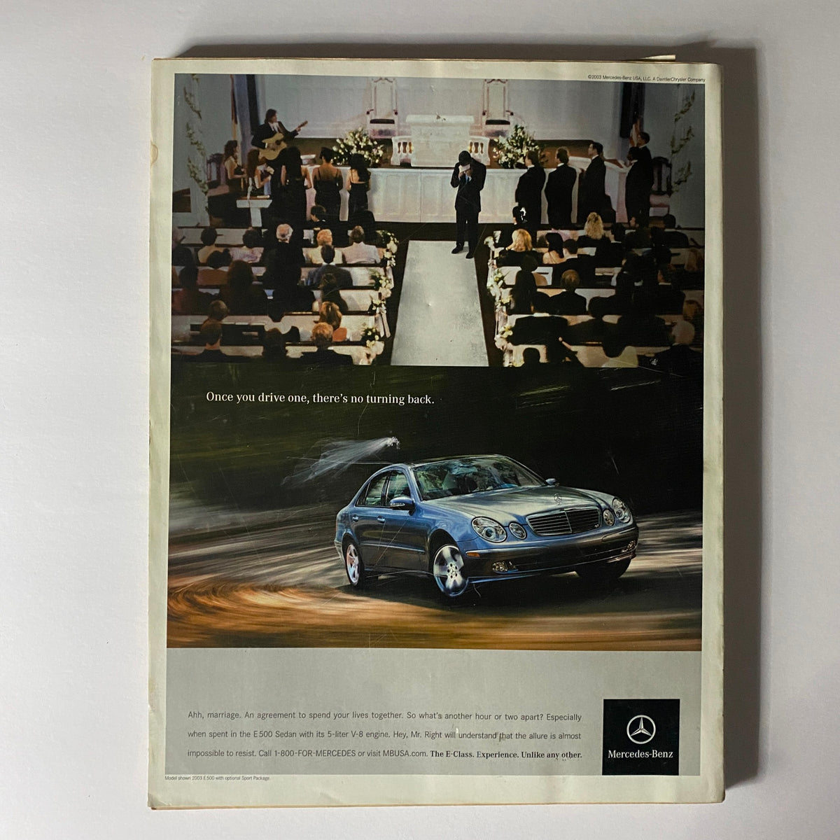 W Magazine May 2003 page displaying a luxury Mercedes-Benz advertisement set in a wedding context, emphasizing sophistication and elegance.