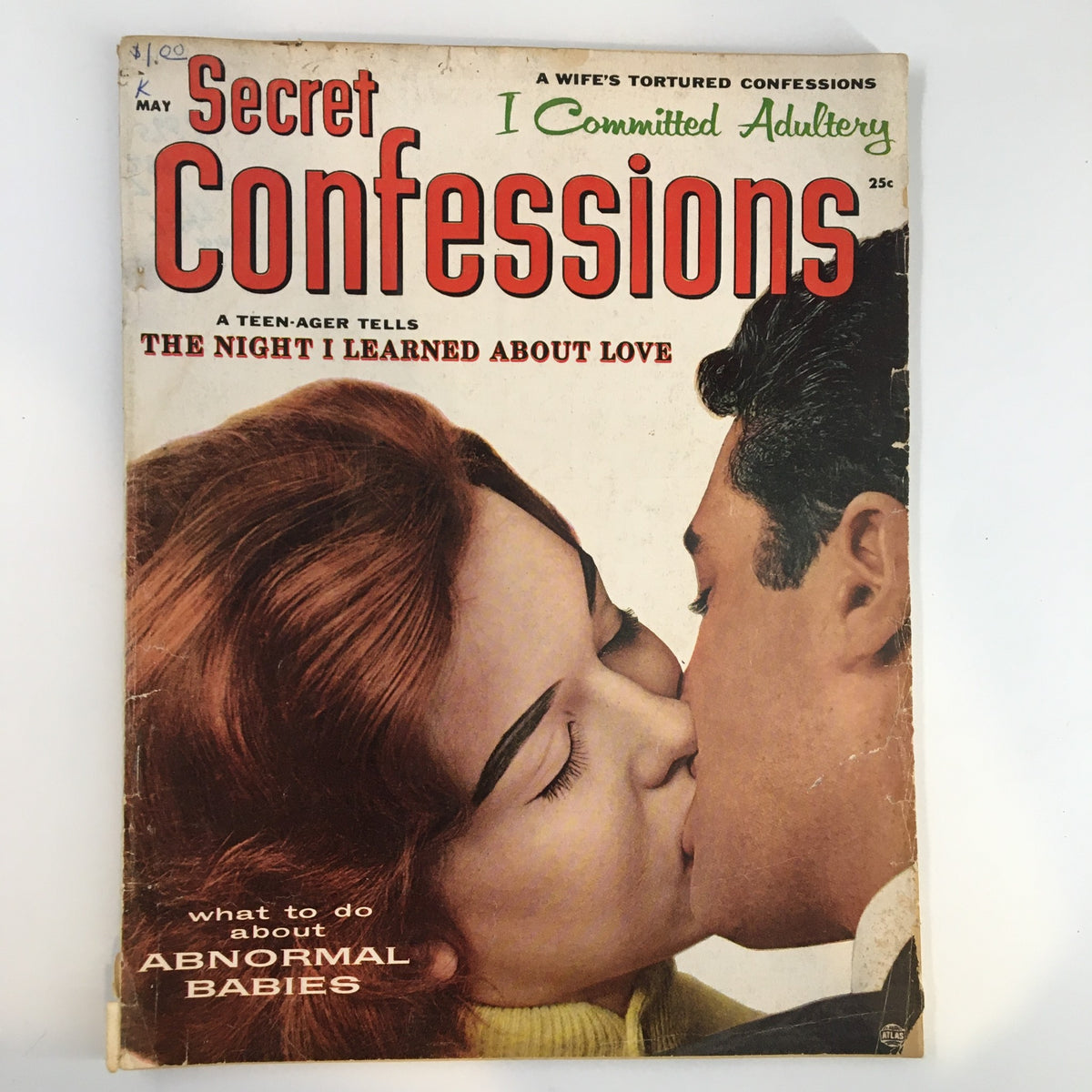 Cover of Secret Confessions Magazine May 1957 featuring the headline 'The Night I Learned About Love' with an image of a couple in an intimate kiss.