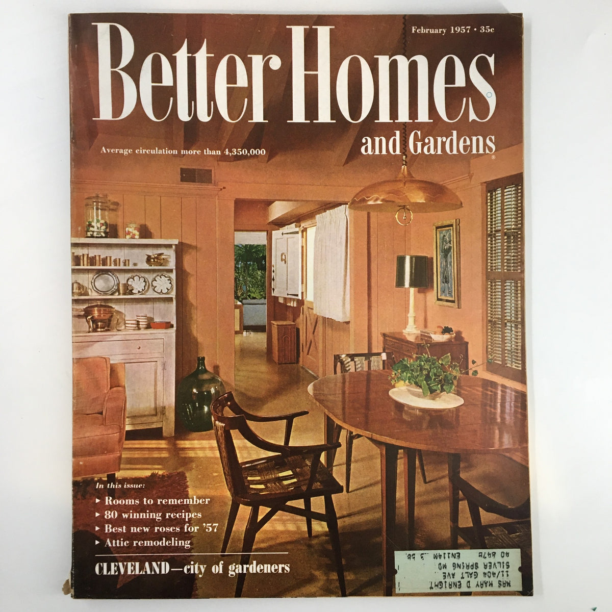 Cover of Better Homes & Gardens Magazine February 1957 featuring a cozy interior scene and showcasing Cleveland as the City of Gardeners.