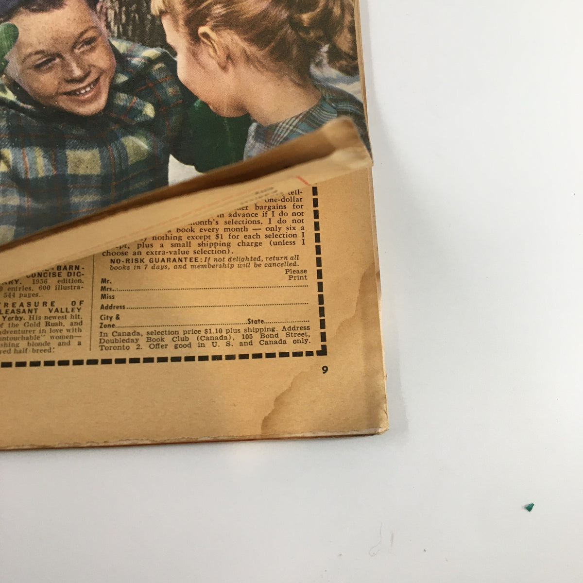 Inside page of Better Homes & Gardens Magazine January 1956 showing children smiling and a glimpse of the magazine's vintage advertisements.