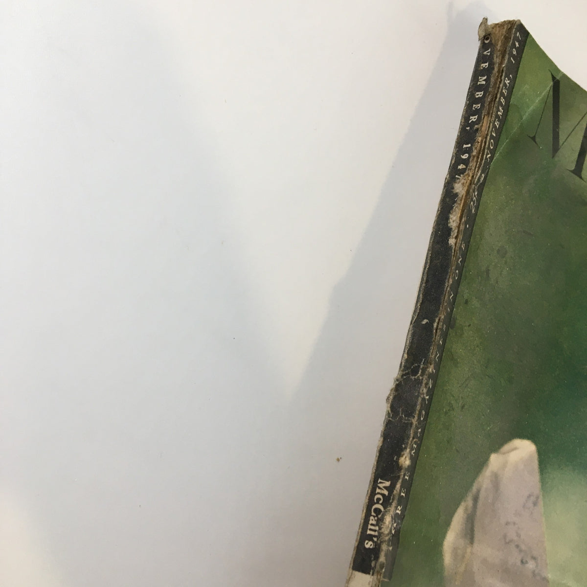 Detail photo of the spine of the November 1947 issue of McCall's Magazine, highlighting its aged appearance and historically significant features. Marry for Money Part Two of Four.