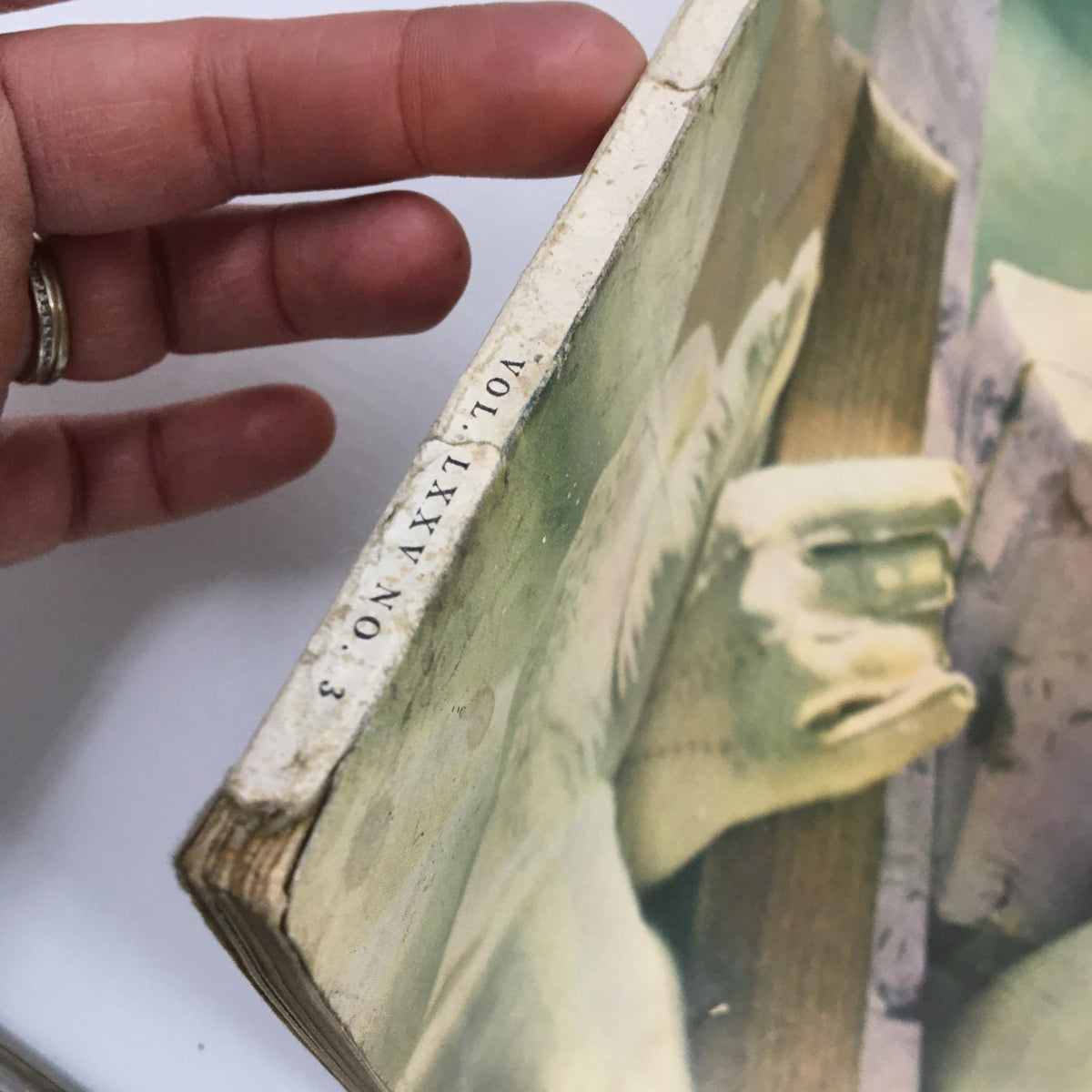 Close-up view of the spine of VTG McCall's Magazine November 1947 showcasing the volume and issue number, depicting the magazine's vintage features.