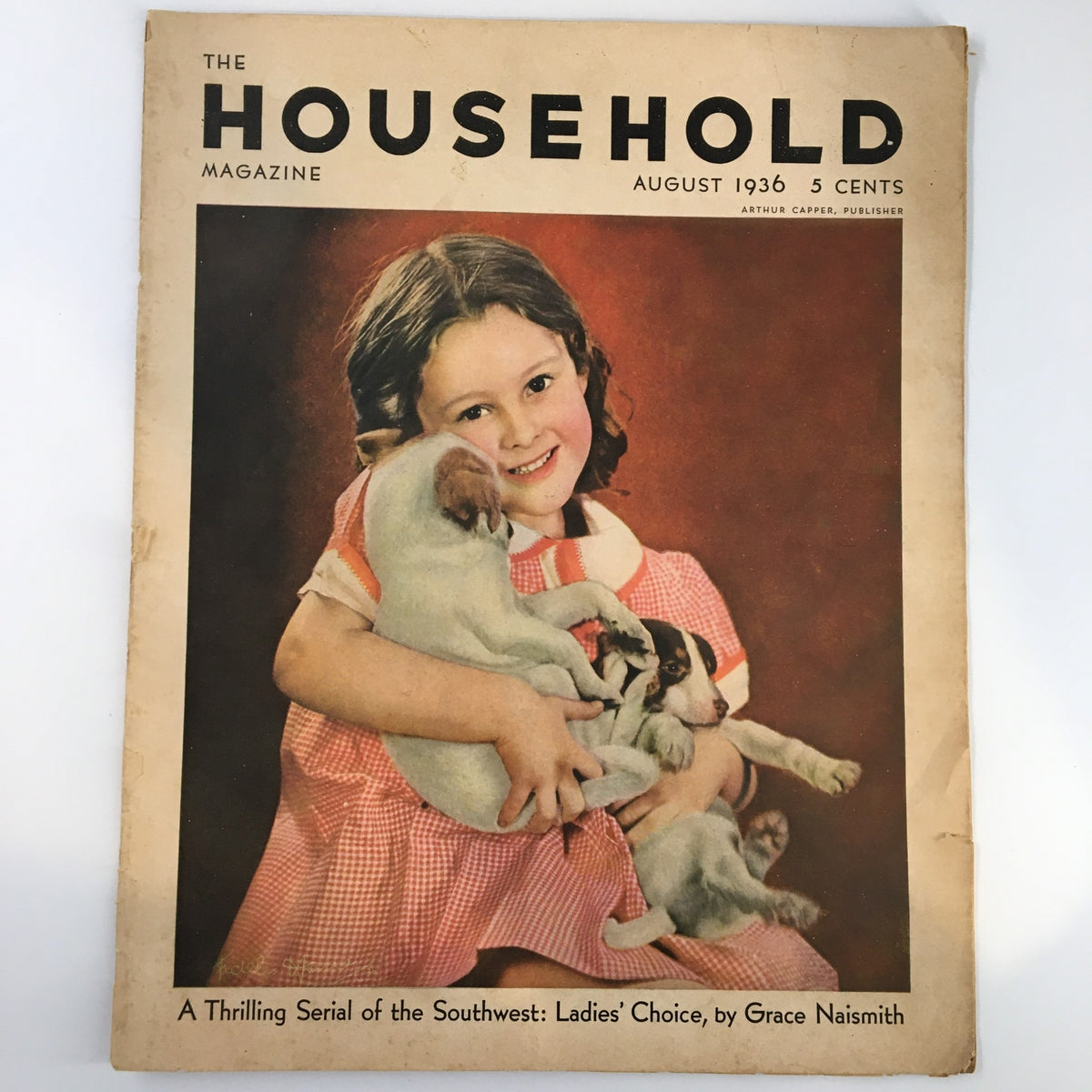 Cover of VTG Household Magazine from August 1936 featuring a young girl smiling while holding several puppies, showcasing vintage charm and design.