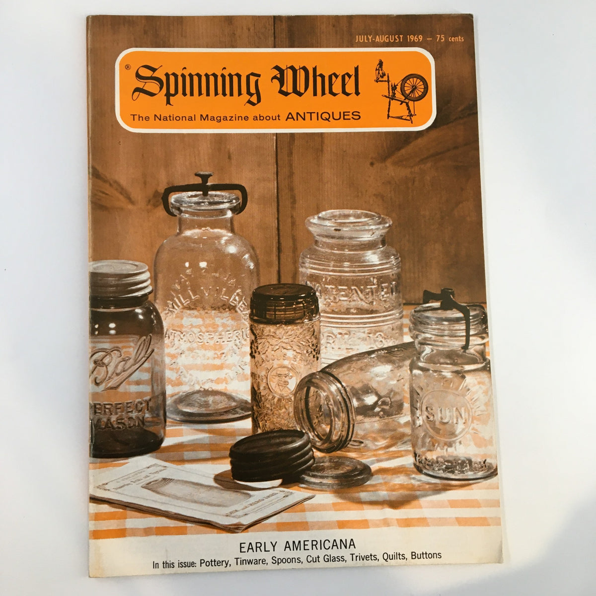 Cover of VTG Spinning Wheel Magazine July 1969 featuring jars and antiques, focusing on pottery, tinware, spoons, and cut glass.
