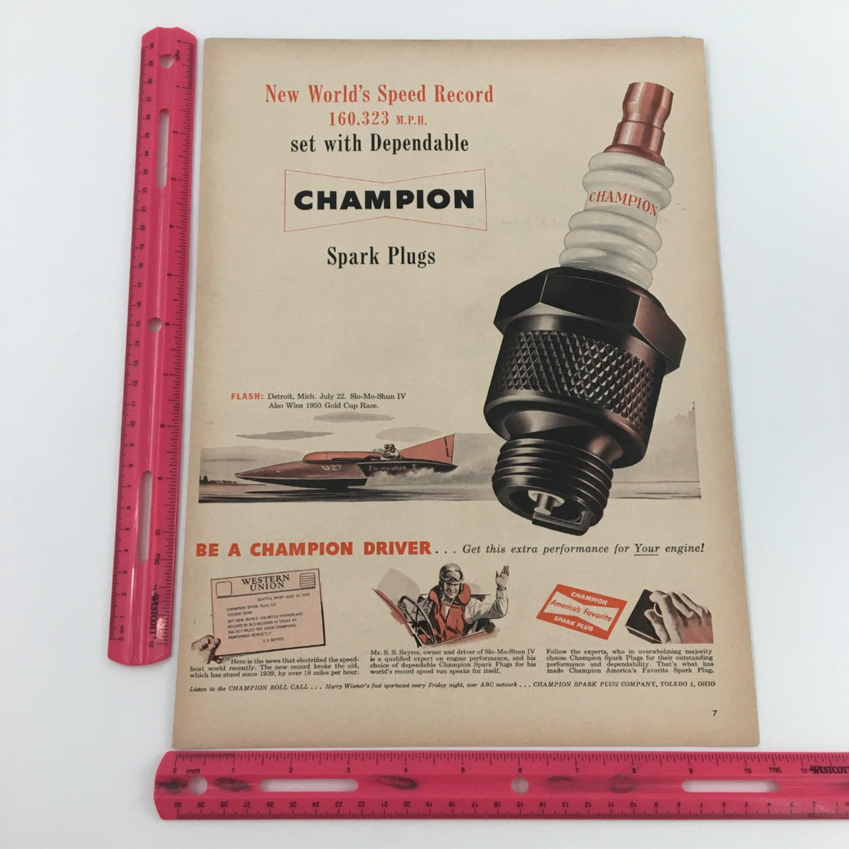 Vintage print ad for Champion Spark Plugs, displaying details about the speed record with a ruler for scale, emphasizing the performance benefits of Champion products.