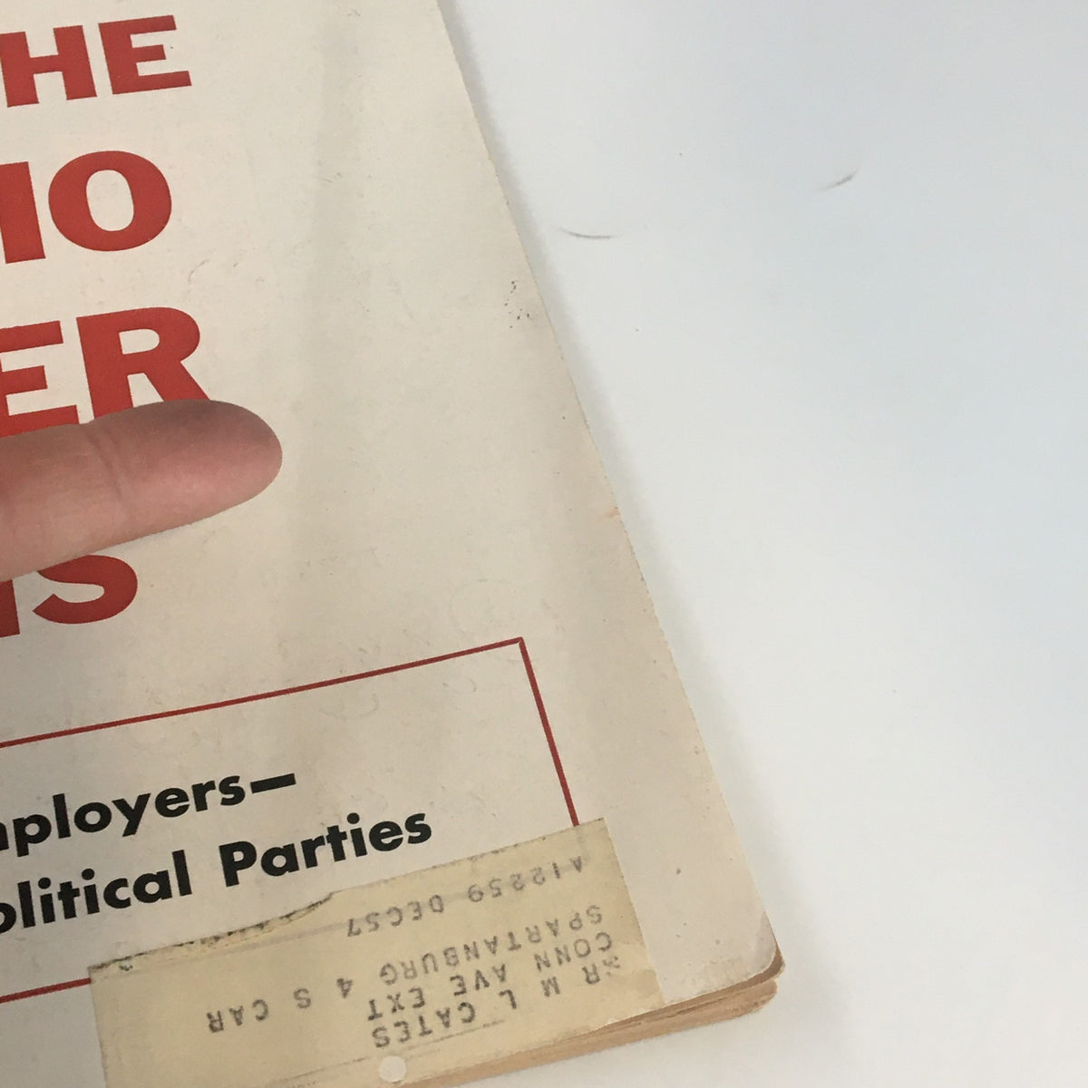 Cover of U.S. News & World Report Magazine dated December 16, 1955, showcasing a poignant image related to Nikita Khrushchev, with visible wear and a finger pointing at the title.