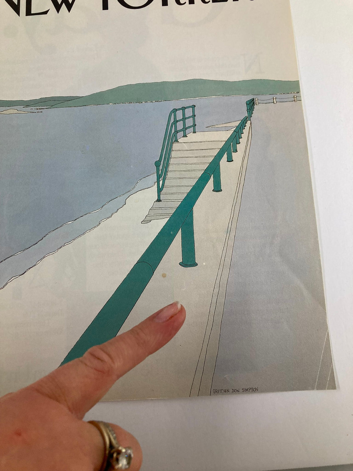 Detail view of The New Yorker cover from September 2, 1985, featuring the Beach Path artwork by Gretchen Dow Simpson, highlighting a finger pointing to the green railing on the walkway.