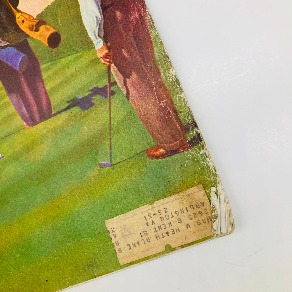 Detail of the lower corner of the Saturday Evening Post Magazine July 3 1948 showing the edge with vintage markings and the golf painting cover by John Falter.
