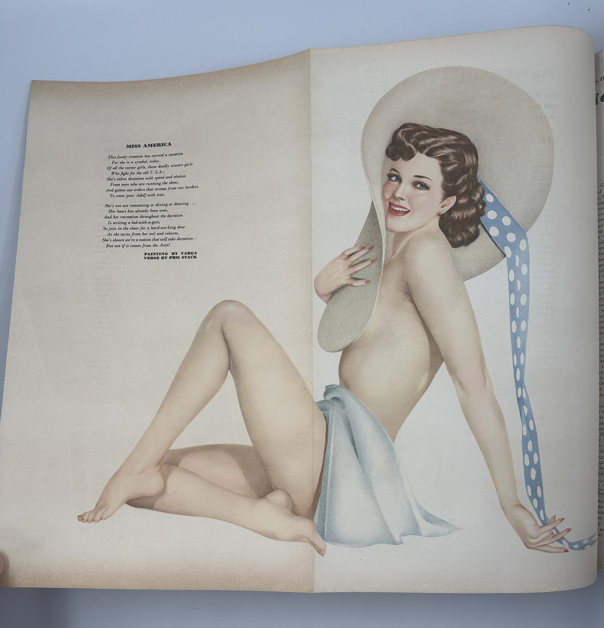Pinup art from Esquire Magazine September 1942, showcasing a semi-nude model in a hat, embodying the classic Varga Girl style popular during WWII.