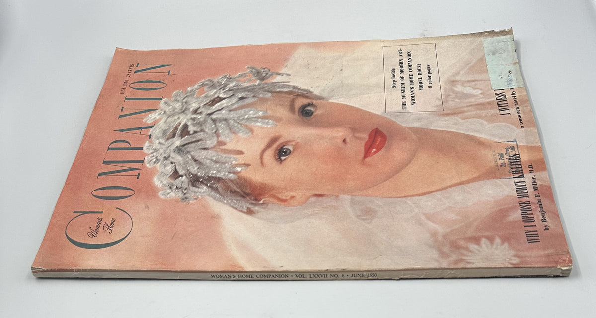 Close-up view of Woman's Home Companion Magazine, June 1950 cover, highlighting a model adorned with a sparkling headdress, advertising the Museum of Modern Art's Model House by Peter Cardozo.