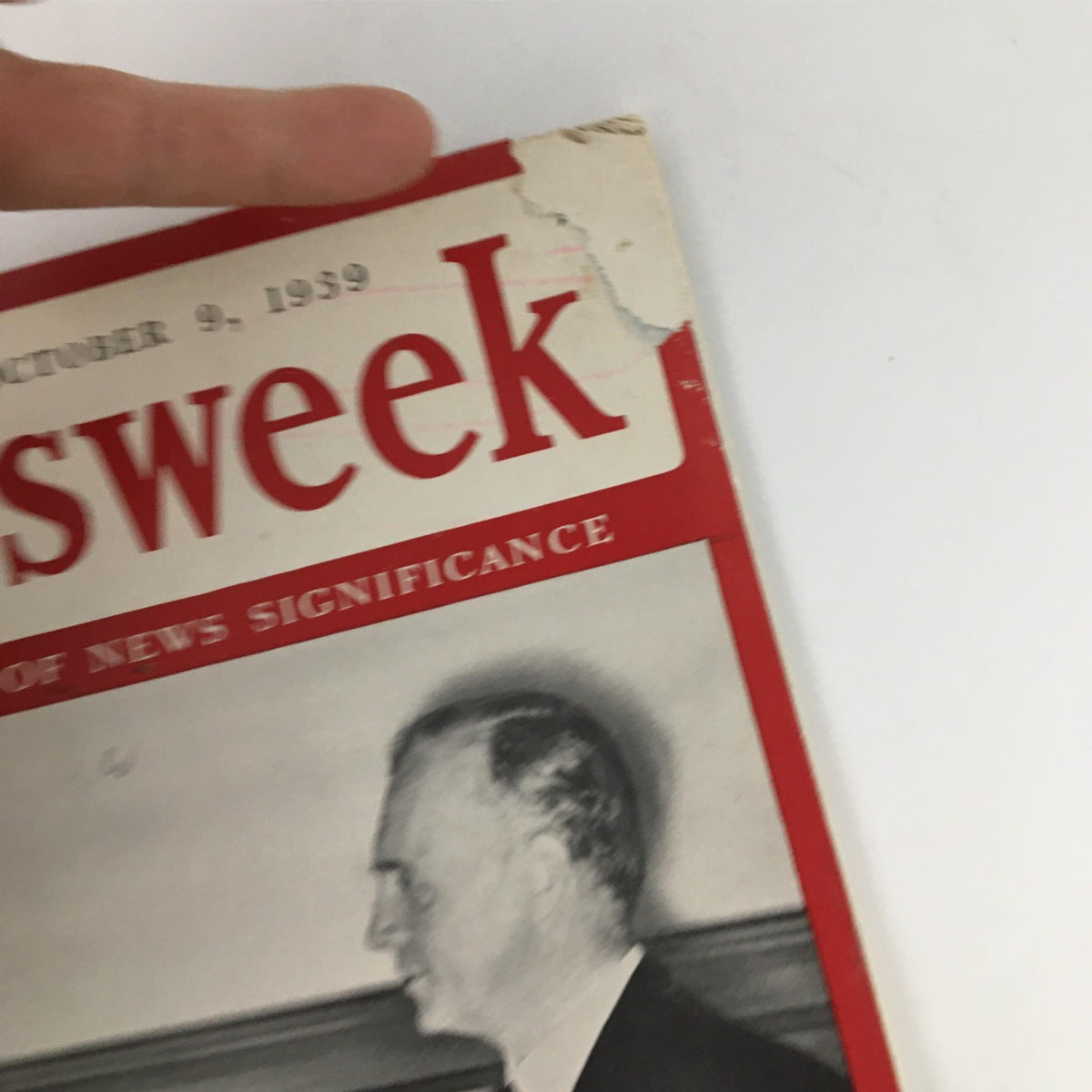 Side view of Newsweek Magazine from October 9, 1939, highlighting the vintage condition and partially torn top edge.