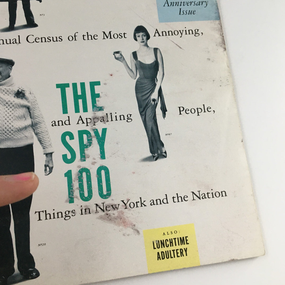 Detailed shot of the Spy Magazine October 1987 cover highlighting elements related to the Spy 100 list, including cultural commentary and notable individuals.