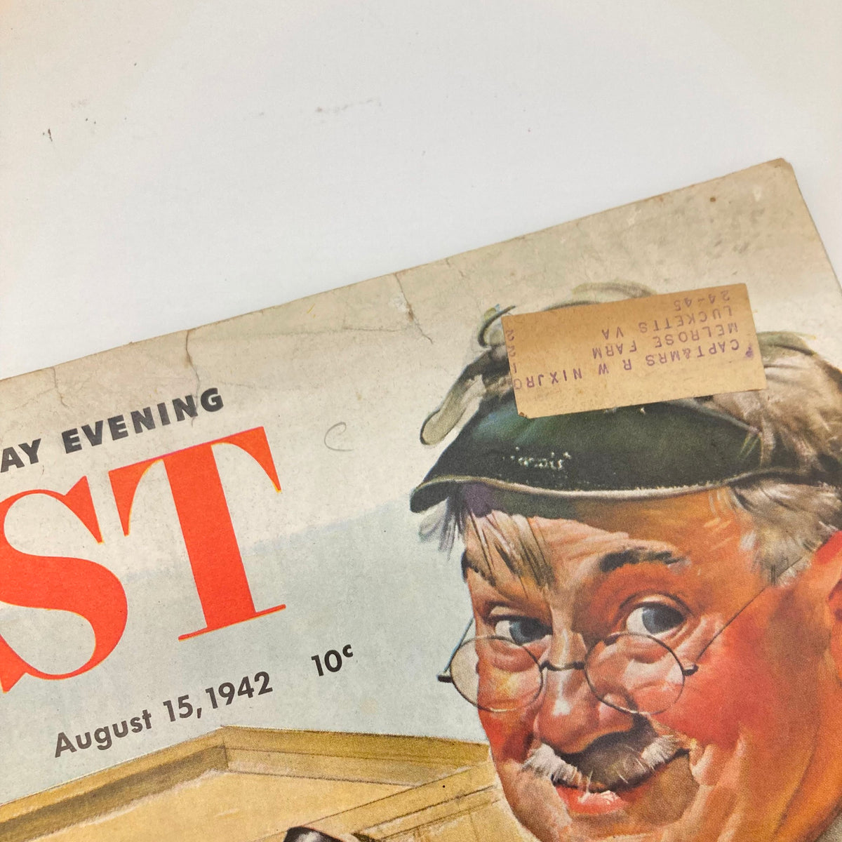 Close-up of the Saturday Evening Post Magazine cover from August 15, 1942, showcasing a man's cheerful expression and a price tag of 10 cents.