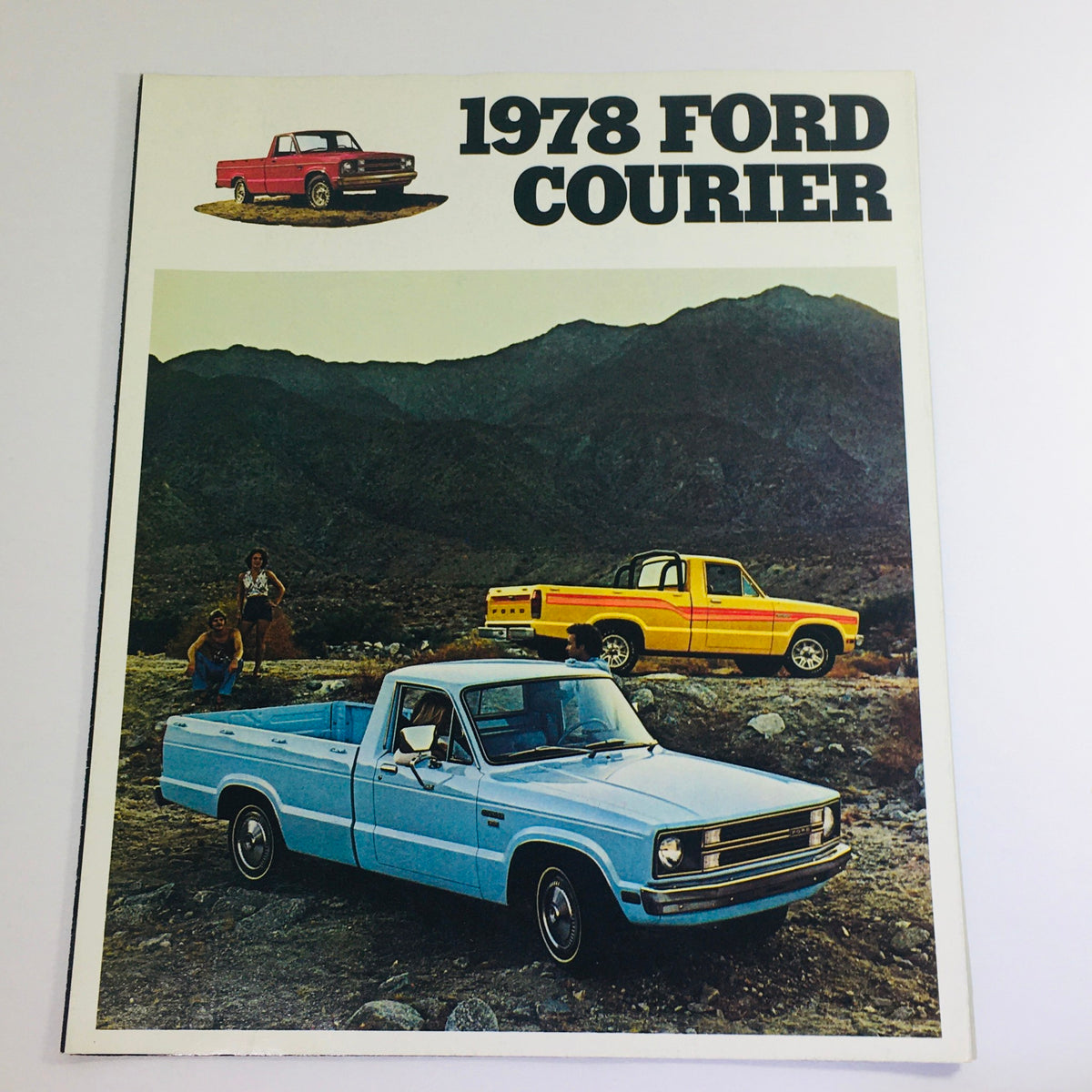 Vintage 1978 Ford Courier 2-Door Pick-Up car brochure cover featuring a blue Ford Courier with a mountainous backdrop and other Ford models prominently displayed.