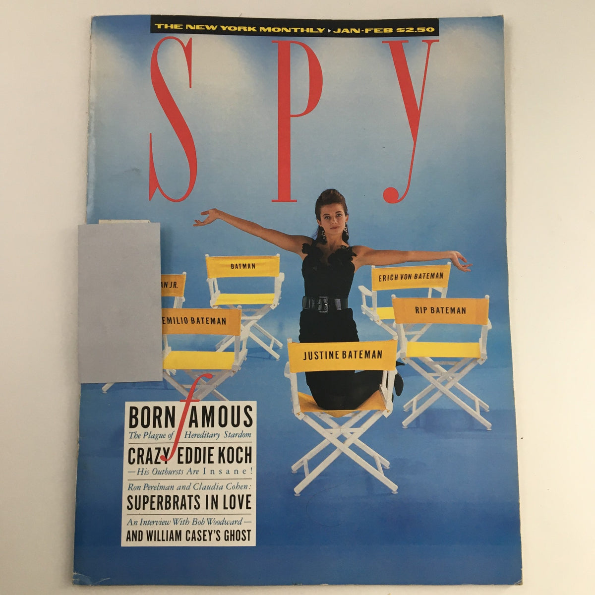 Cover of Spy Magazine January-February 1988 featuring Justine Bateman, with a striking layout of white director's chairs and bold text, presenting articles on pop culture and media commentary.