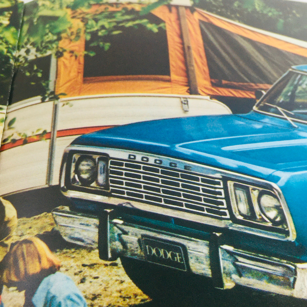 Detail of a vintage Dodge truck front view featured in the 1978 brochure, symbolizing adventure under the title 'A New Set of Adult Toys from Dodge'.