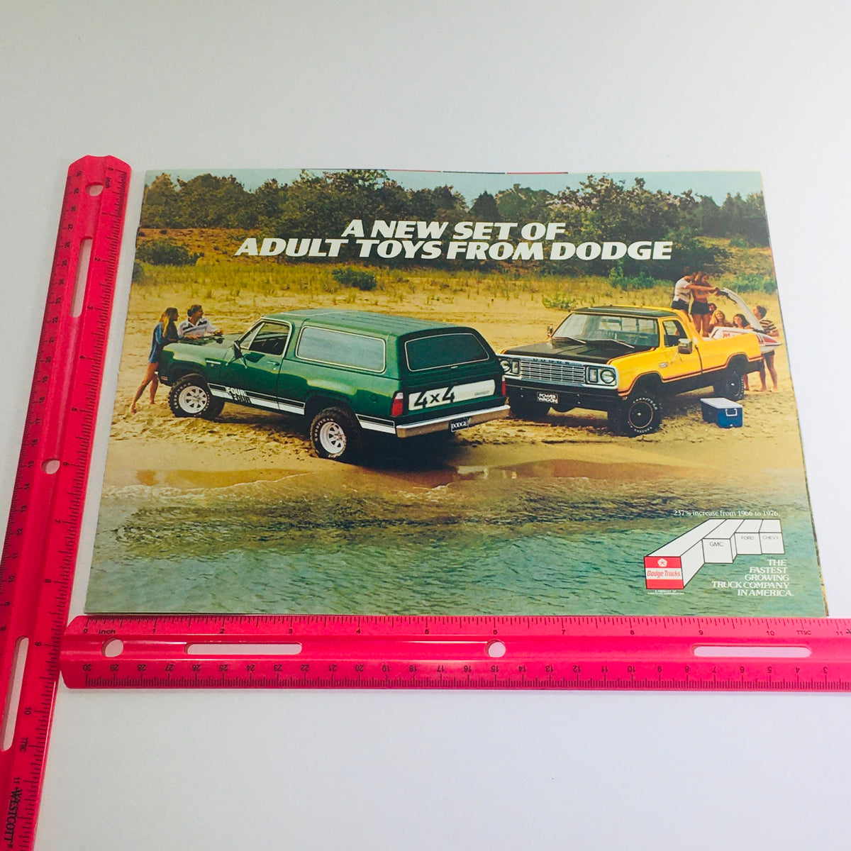 1978 Adult Toys from Dodge brochure featuring a green truck and yellow pickup at a beach, illustrating the adventurous spirit of Dodge vehicles from the era.