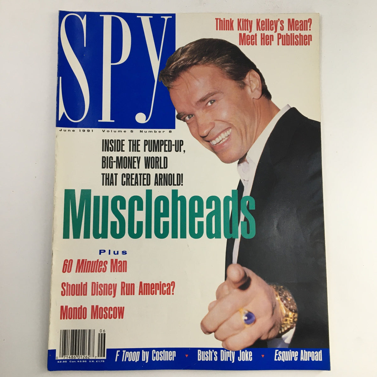 Cover of Spy Magazine from June 1991 featuring Arnold Schwarzenegger, with a focus on the headline 'Muscleheads'. Contains notable articles including '60 Minutes Man' and 'Should Disney Run America?'. Perfect for collectors of vintage pop culture magazines.