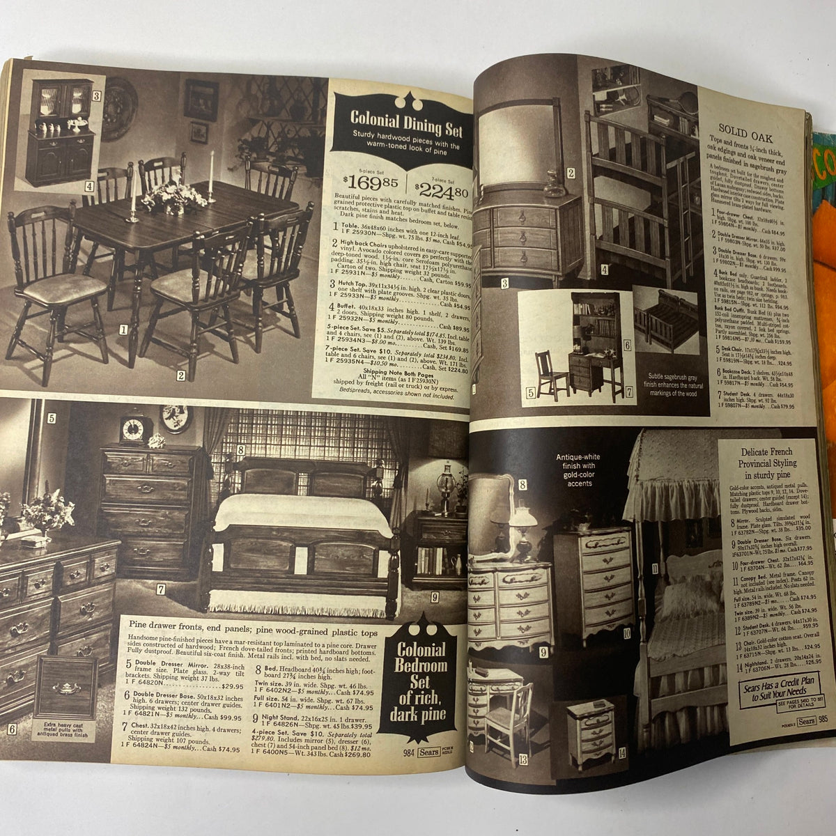 Interior page of the 1969 Sears Fall and Winter Catalog showcasing a Colonial Dining Set and Colonial Bedroom Set, featuring wooden furniture with pricing details and product descriptions.