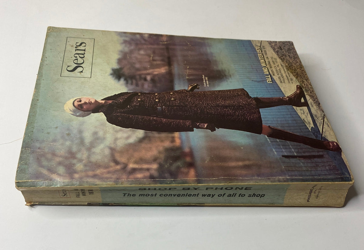 Side view of the 1970 Sears Fall and Winter Catalog, highlighting the vintage design and condition of the magazine featuring a fashionable model on the cover.