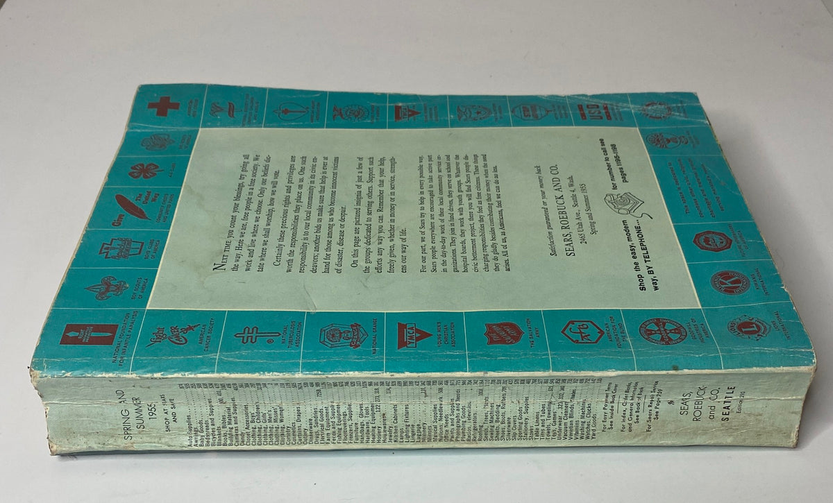 Side view of the 1955 Sears Roebuck and Co. Spring and Summer Catalog, showing its spine and the blue cover design.