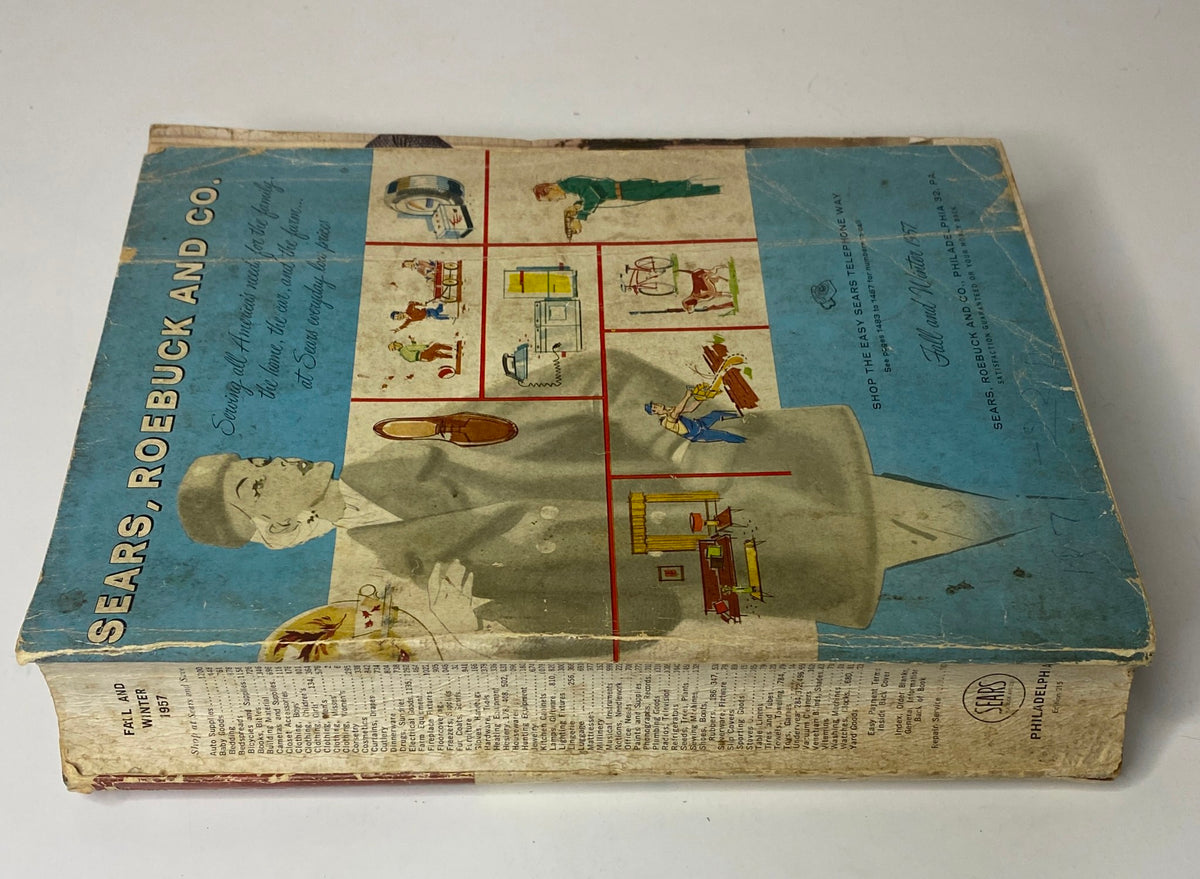 Spine view of the 1957 Sears Roebuck and Co. Fall and Winter Catalog showing its title and illustrations related to home and fashion.