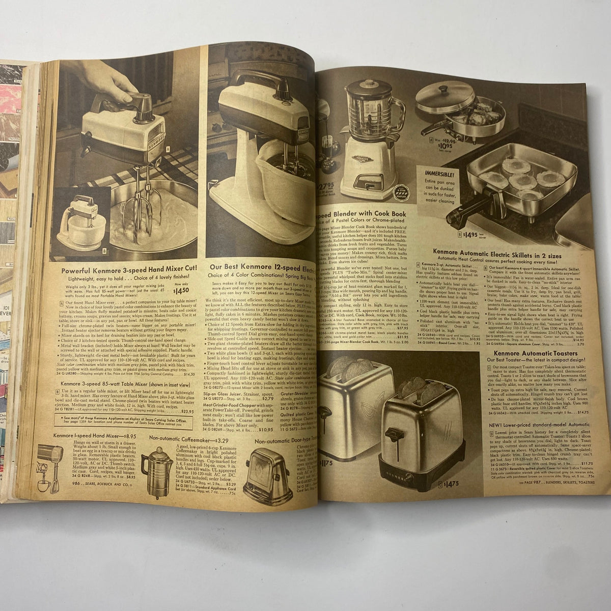 Interior pages of the 1956 Sears Roebuck and Co. Fall and Winter Catalog displaying Kenmore kitchen appliances including mixers and blenders, showcasing mid-century design.