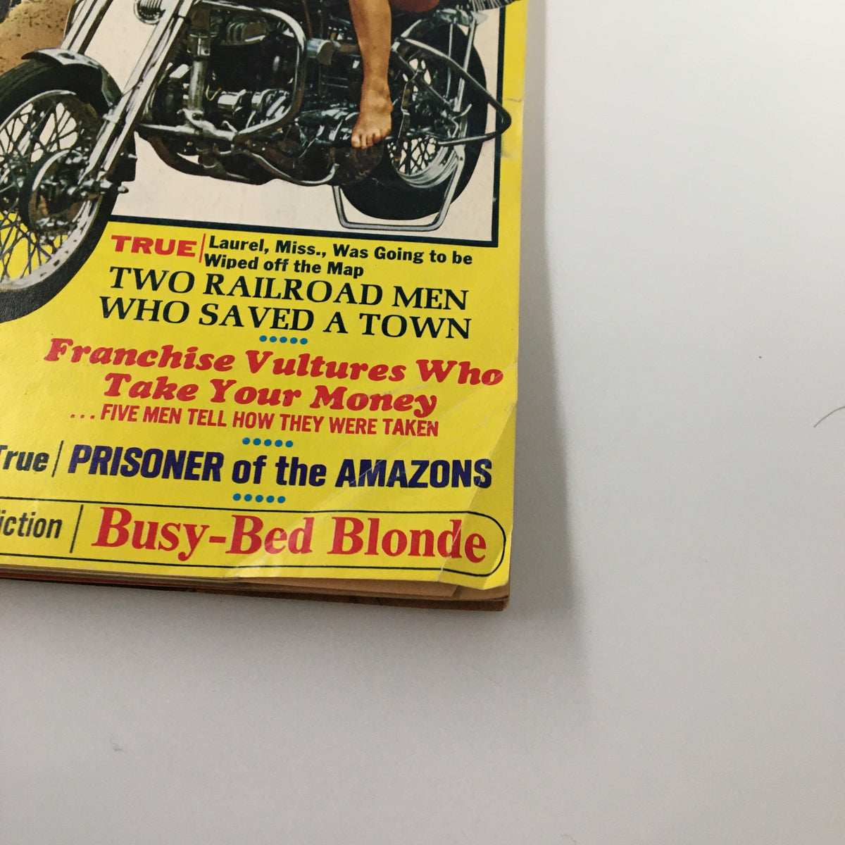 Detail view of the side cover text from VTG Male Magazine May 1972 showcasing articles like 'Two Railroad Men Who Saved A Town' and 'Franchise Vultures Who Take Your Money'.