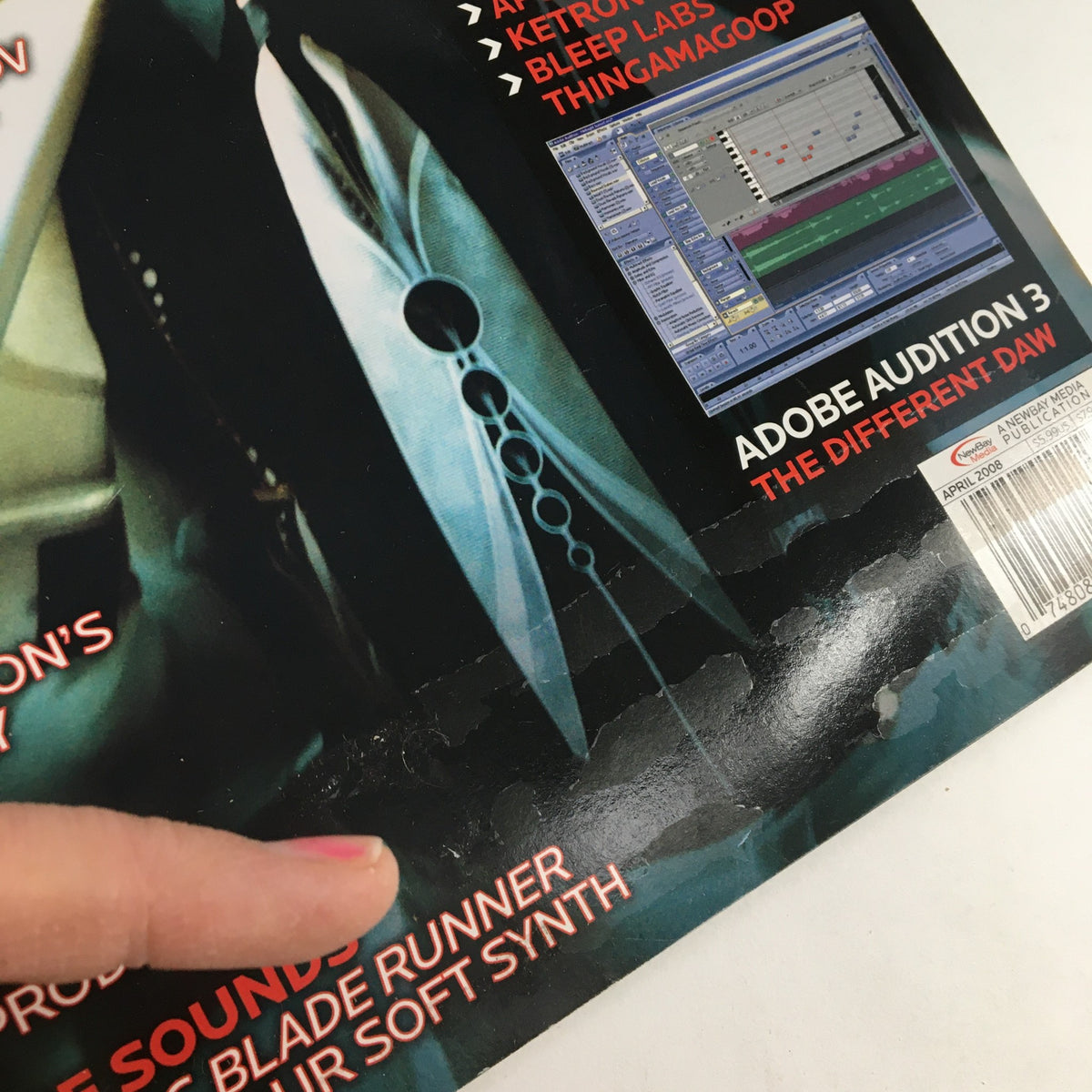 Cover detail of Keyboard Magazine April 2008, featuring insights on Adobe Audition 3 and elements related to keyboard innovation, with a finger pointing at the text. This issue includes articles on Medeski Martin, Ricky Peterson, and Lisa Harriton.