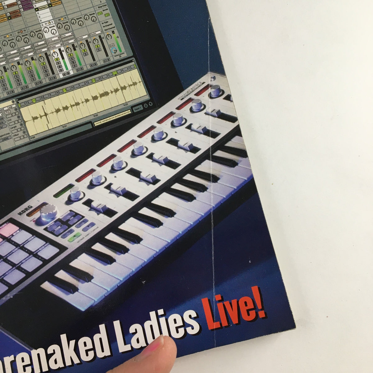 Close-up detail of Keyboard Magazine February 2004 showcasing Ableton Live 3 and the tagline 'Barenaked Ladies Live!' highlighting key features and content about music production.