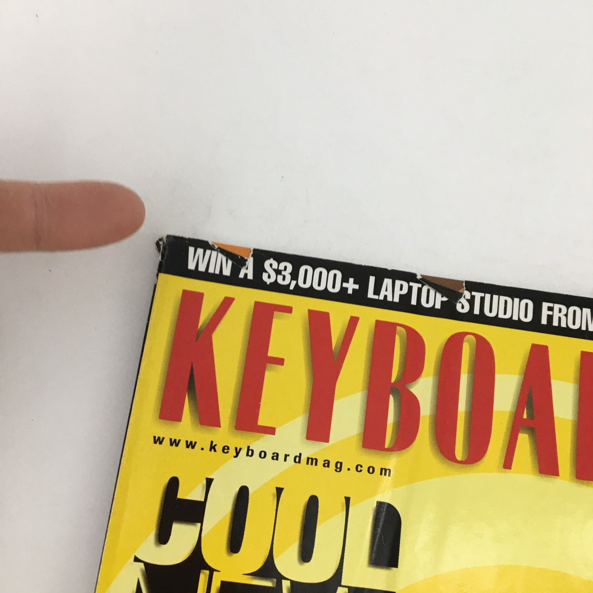 Close-up view of the upper edge of Keyboard Magazine June 2004, displaying part of the text about a $3,000 laptop studio giveaway from Digidesign.