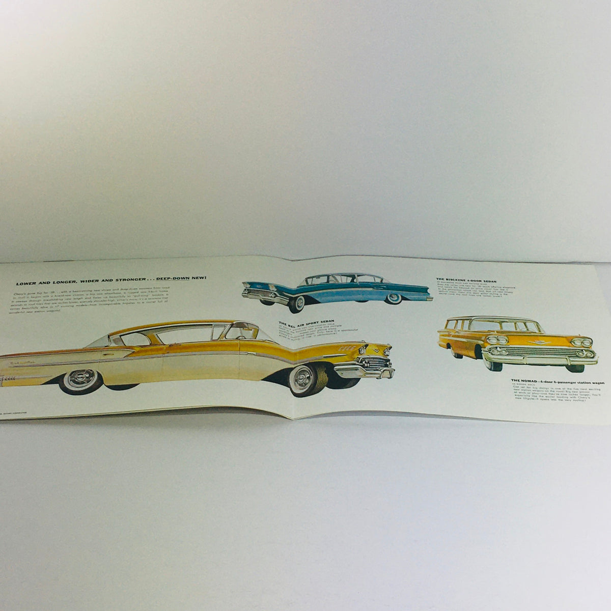 Inside view of the 1958 Chevrolet Bel Air Corvette Dealership Car Auto Brochure Catalog with illustrations of classic cars, emphasizing the vehicle designs from the 1958 Chevrolet lineup.