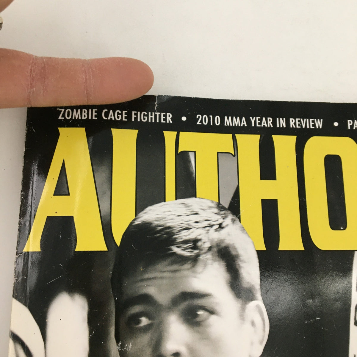 Close-up shot of Authority MMA Magazine 2010 #11 cover, highlighting the title 'Authority' and a featured fighter, part of the vintage MMA publication collection.