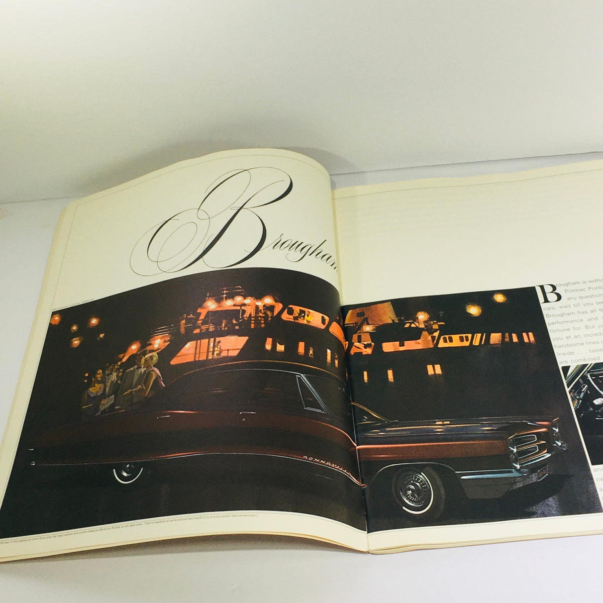 Interior page of the 1966 Pontiac Brougham Specifications Dealership Car Auto Brochure Catalog featuring a stylish photograph of the Pontiac Brougham surrounded by luxurious ambiance, highlighting classic automotive design.