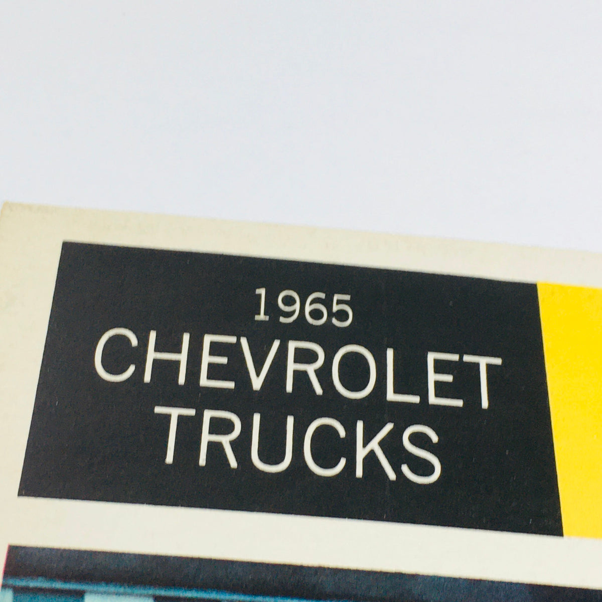 Close-up of the title from the 1965 Chevrolet Full-Line Truck Selector Dealership Car Auto Brochure Catalog.