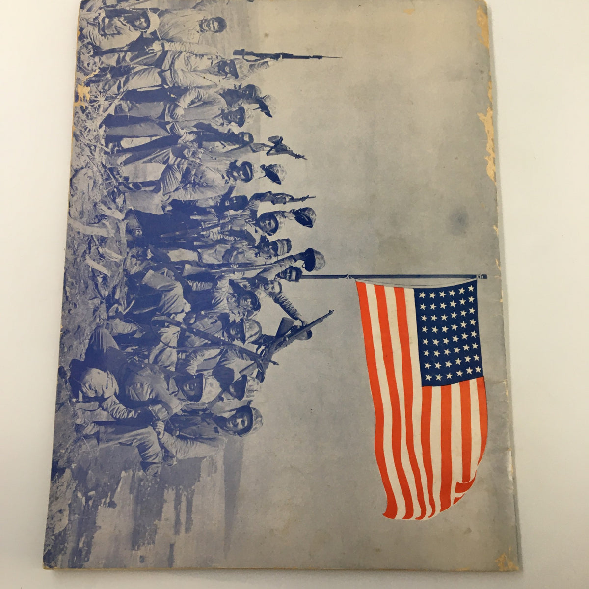 Cover of VTG The Indianapolis News featuring soldiers and the American flag, representing wartime patriotism during World War II.