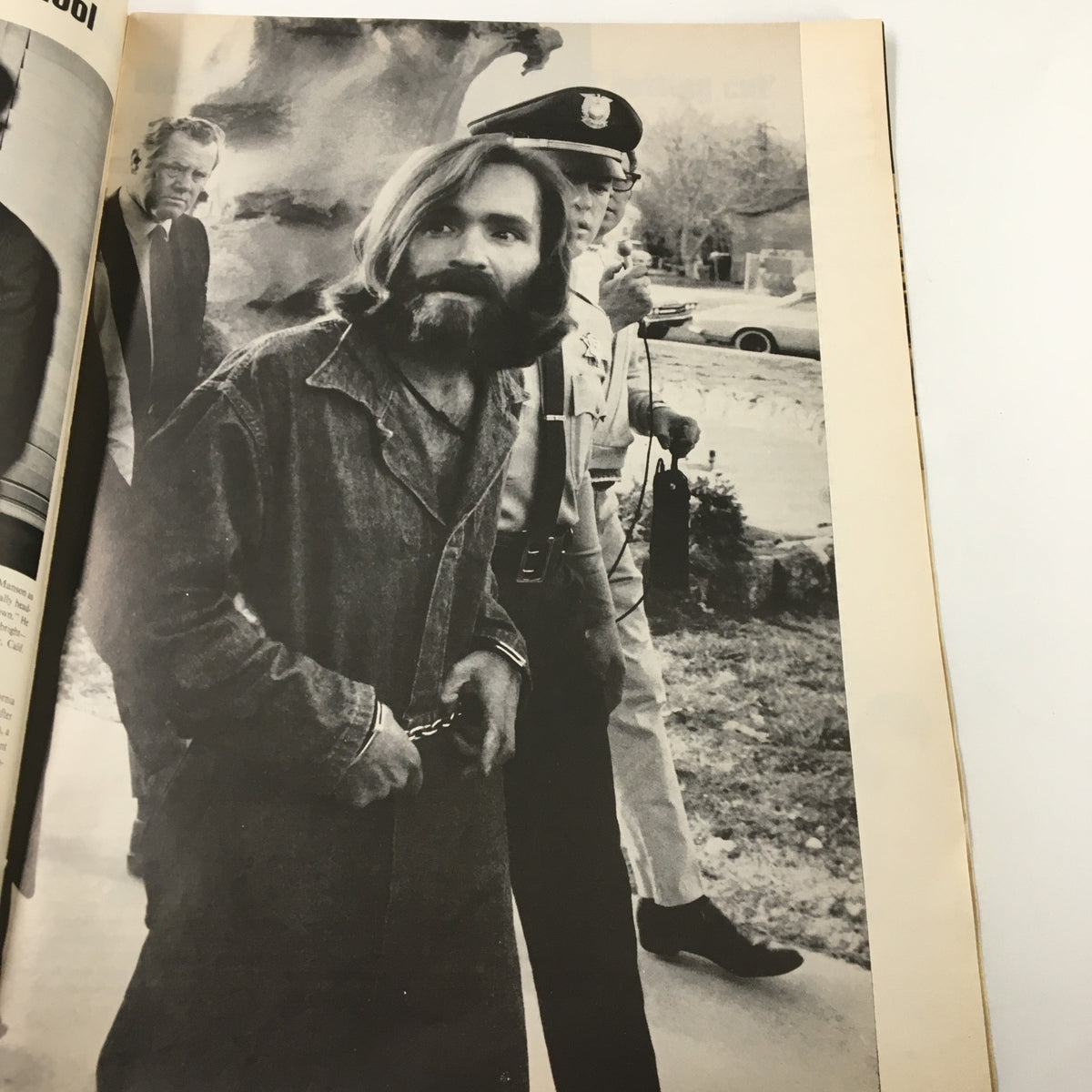 Vintage Life Magazine December 19 1969 image of Charles Manson in handcuffs, captured during his arrest, highlighting his controversial influence as detailed in the magazine.