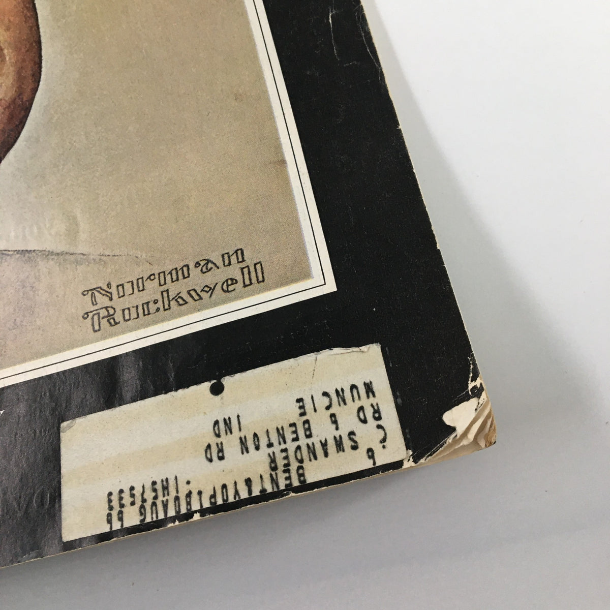 Detailed view of the signature of Norman Rockwell on the cover of The Saturday Evening Post December 14 1963 featuring John F. Kennedy, showcasing the artist's identity.