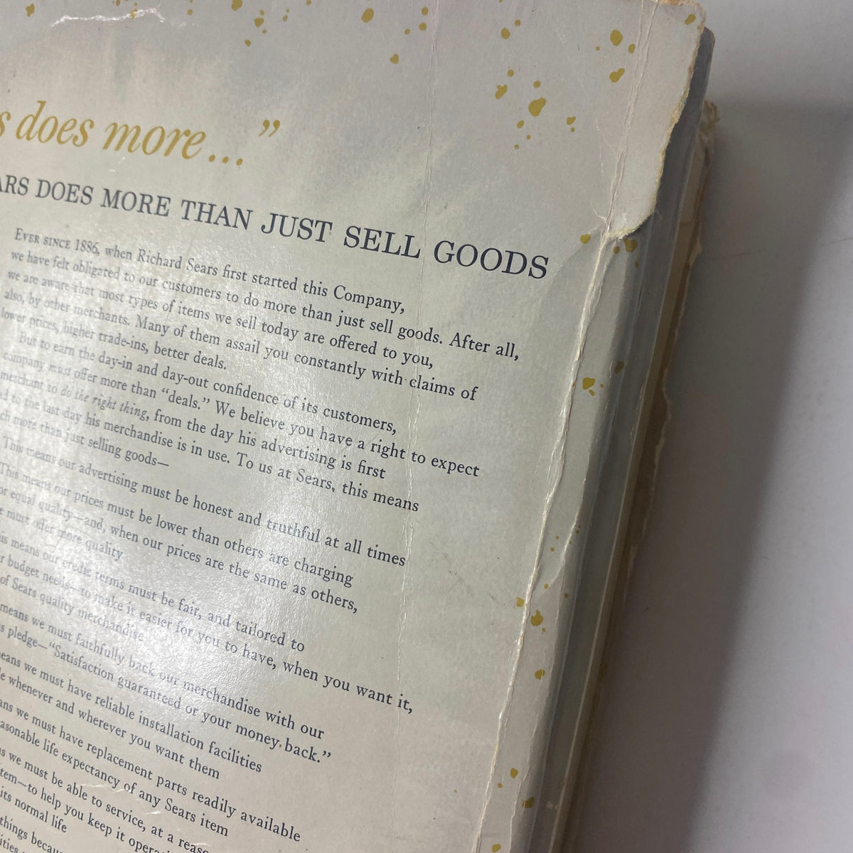 Close-up of the back cover of the 1961 Sears Roebuck and Co. Spring and Summer Catalog, highlighting the text emphasizing the company's pledge to honesty and quality in advertising.