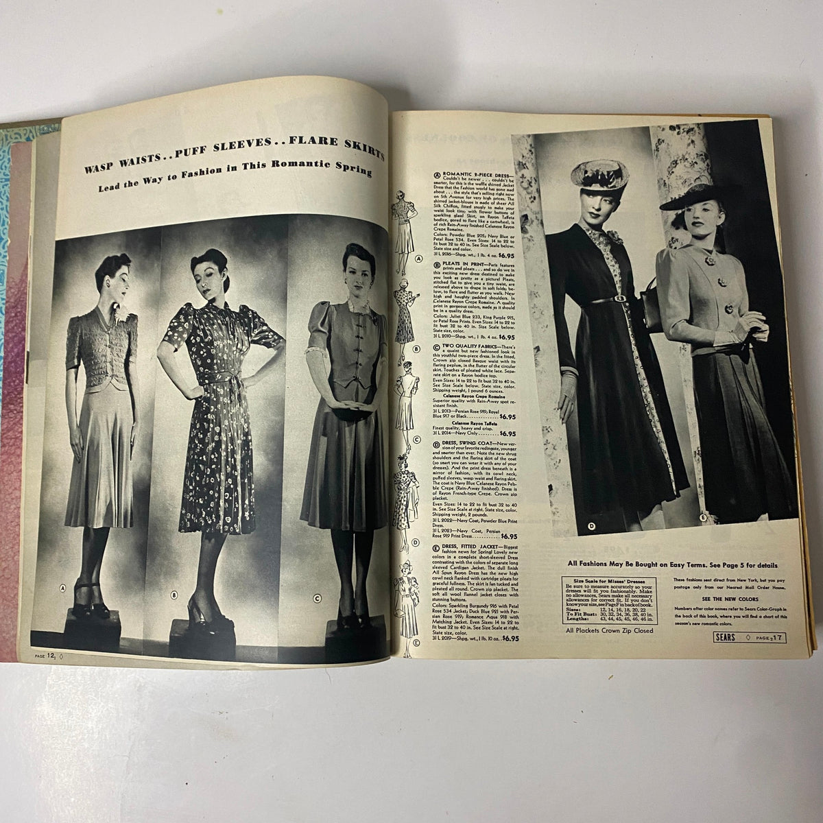 Fashion plate from the 1939 Sears, Roebuck and Company Spring and Summer Hardcover Catalog showcasing dresses with wasp waists, puff sleeves, and flared skirts.
