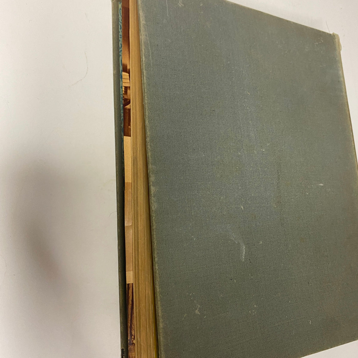 Side view of the 1939 Sears, Roebuck and Company Spring and Summer Hardcover Catalog, showcasing the vintage hardcover's binding and aged edges, ideal for collectors or vintage magazine enthusiasts.